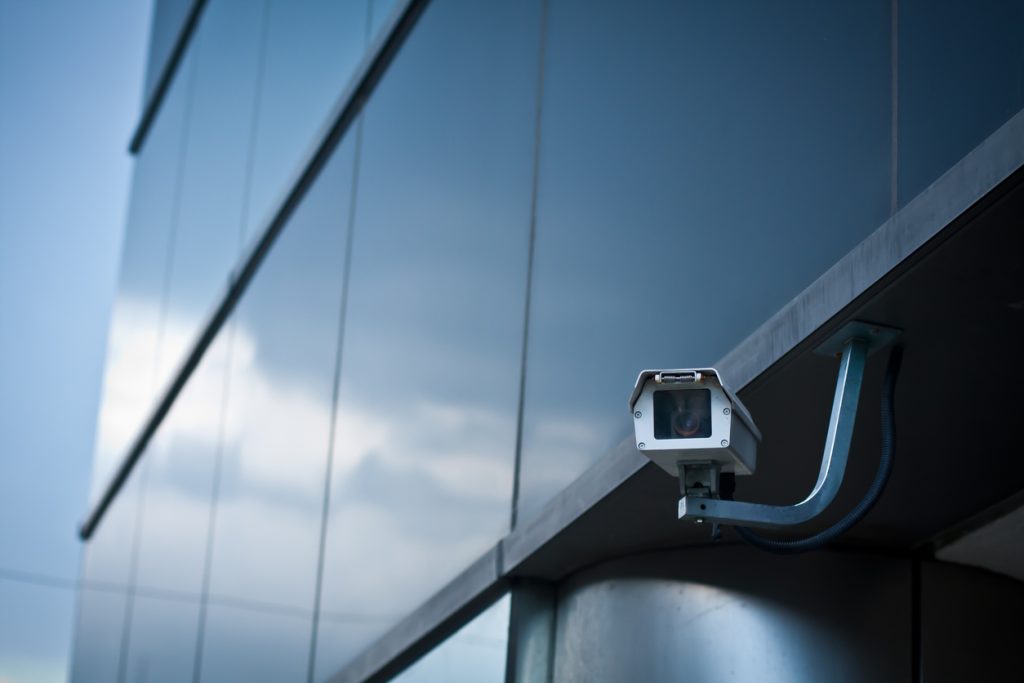 A security camera on the exterior of a building.